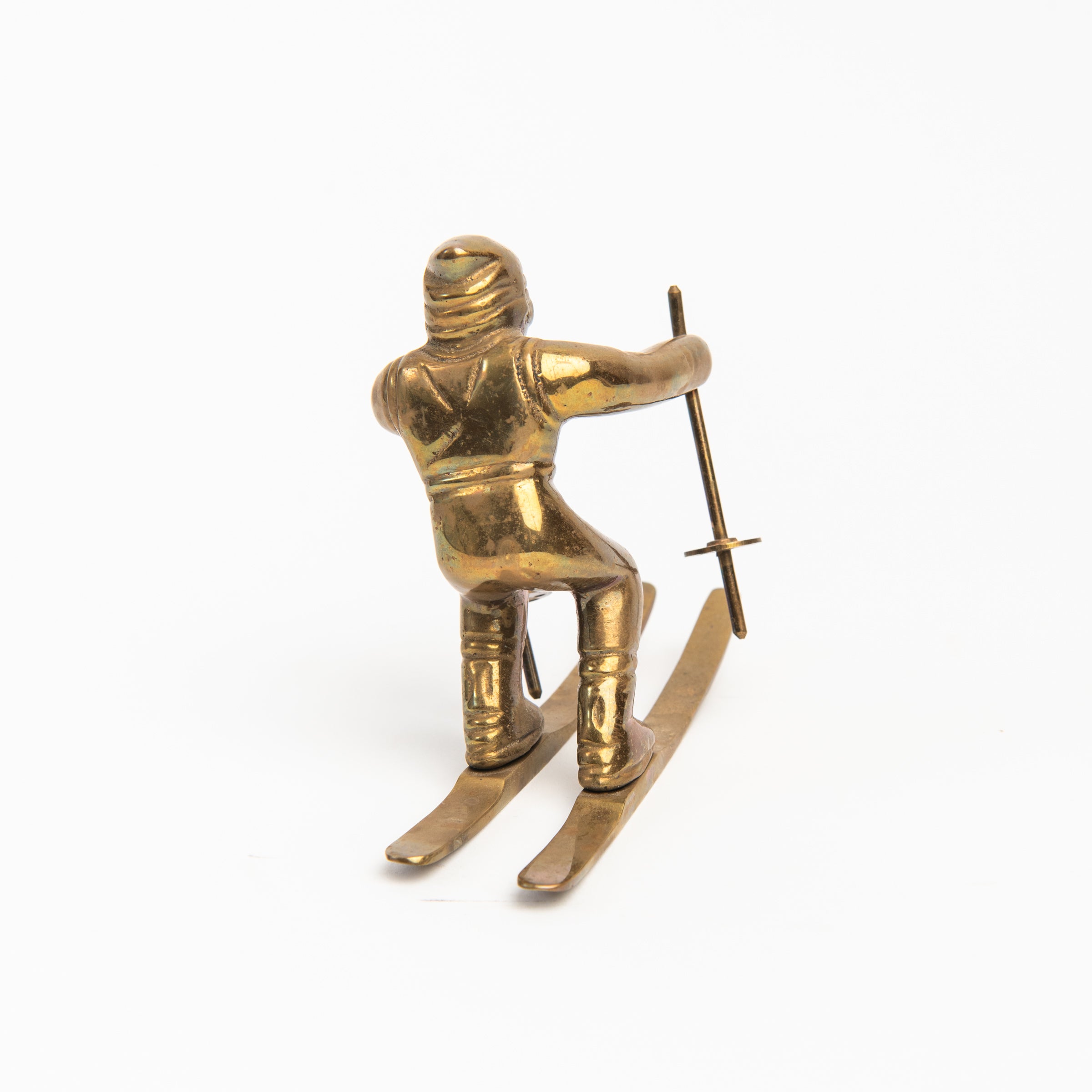 Vintage Brass Skier on a white background at Addison West