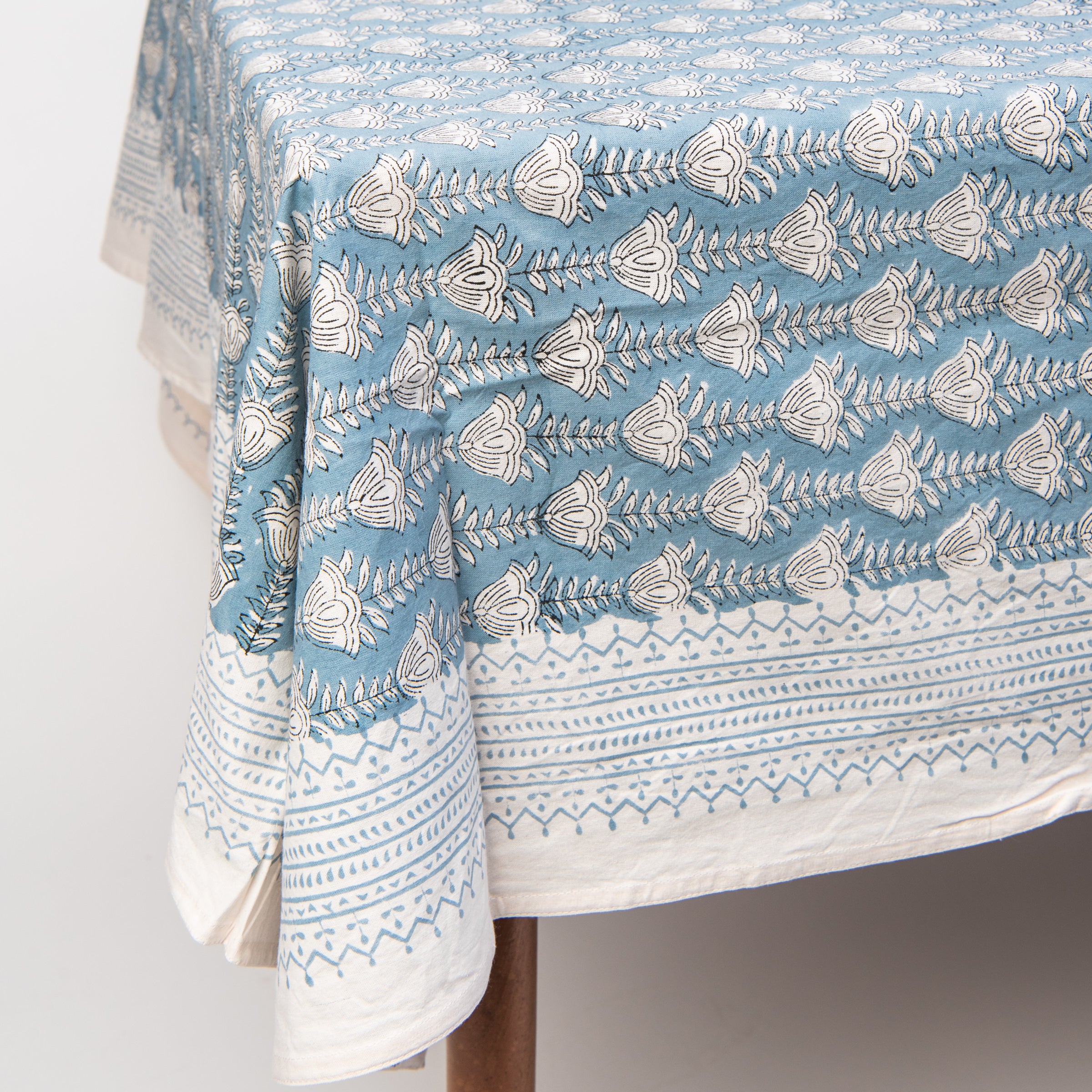 Bluebell Block Print Tablecloth on a table on a white background at Addison West