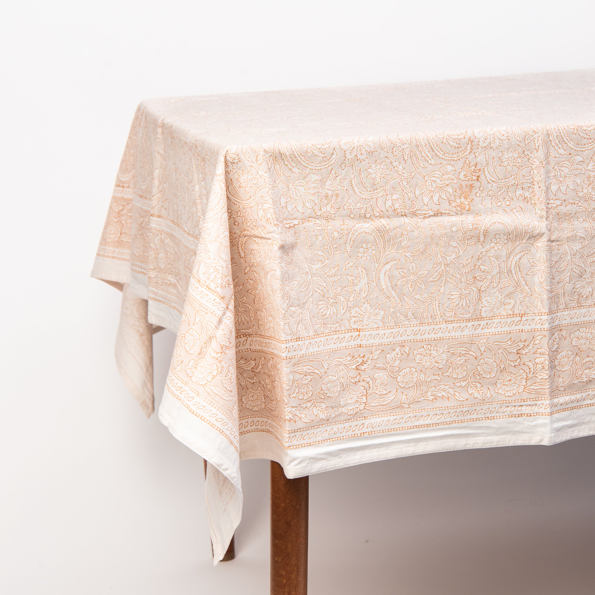 Clementine Block Print Tablecloth on a table on a white background at Addison West