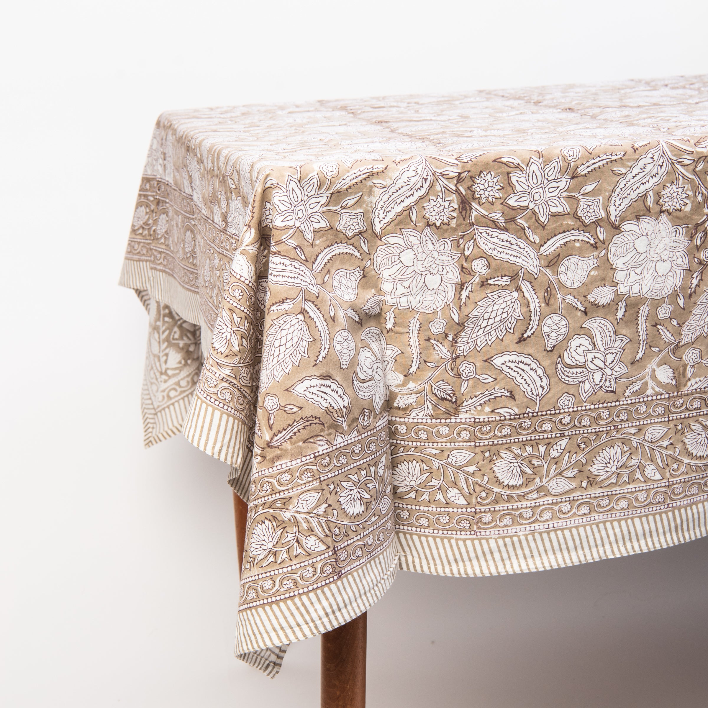 Sable Block Print Tablecloth on a table on a white background at Addison West