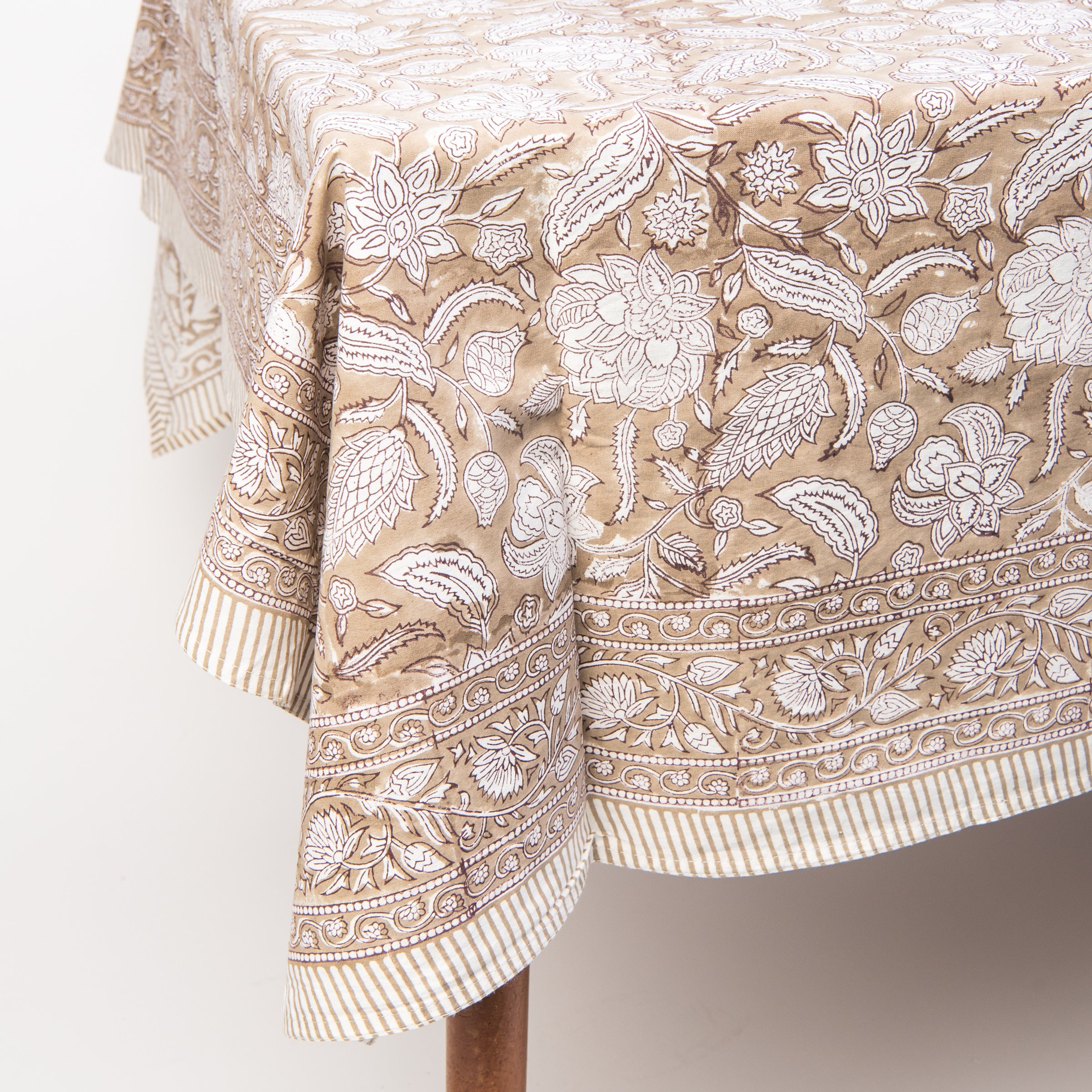 Sable Block Print Tablecloth on a table on a white background at Addison West