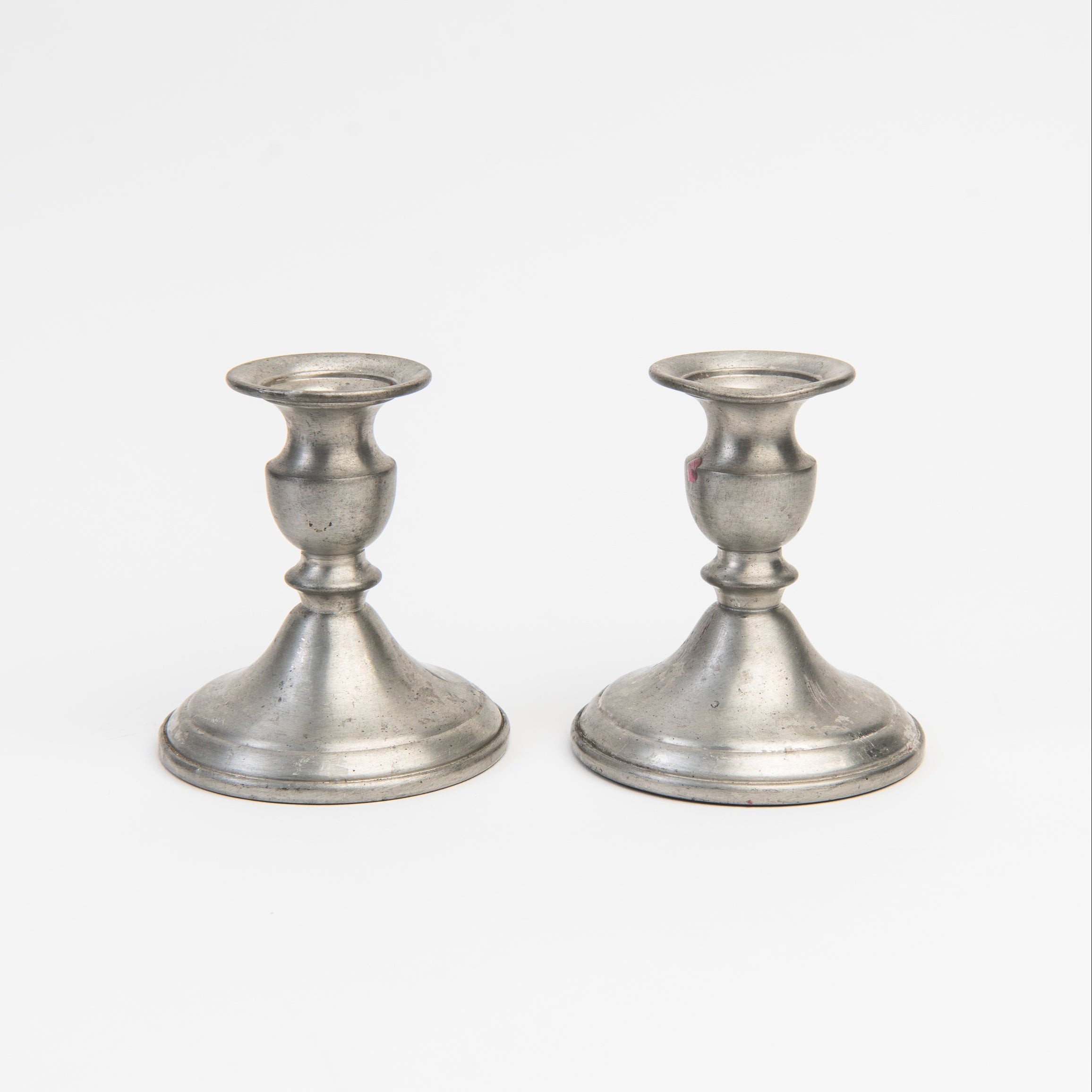 Vintage Web Weighted Pewter Candlesticks on a white background at Addison West