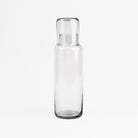 Recycled Glass Decanter with Drinking Glass on a white background at Addison West