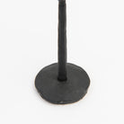 Close up of Legacy Forged Candlestick on a white background at Addison West