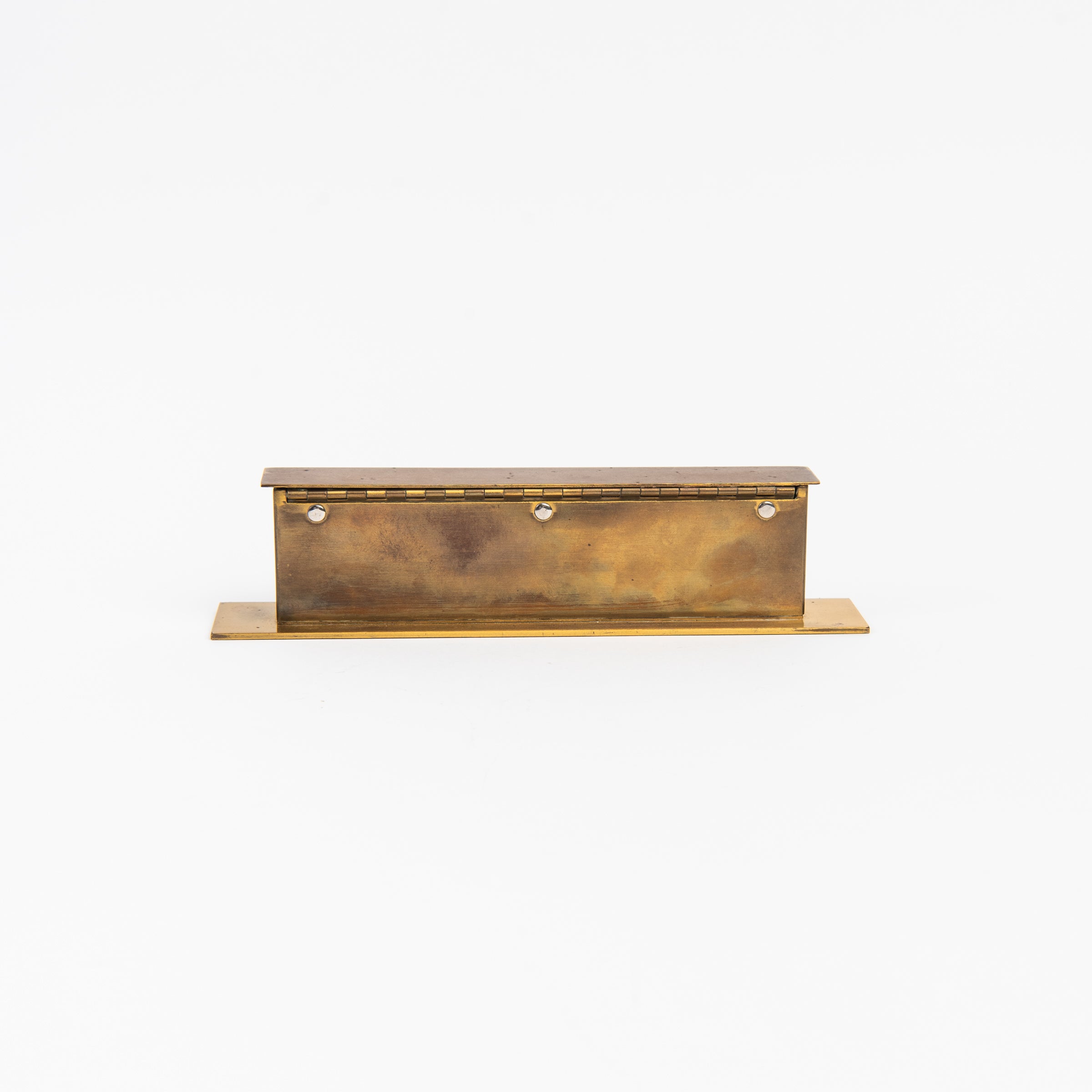Back of Vintage Brass Calendar on a white background at Addison West