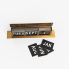 Vintage Brass Calendar on a white background at Addison West