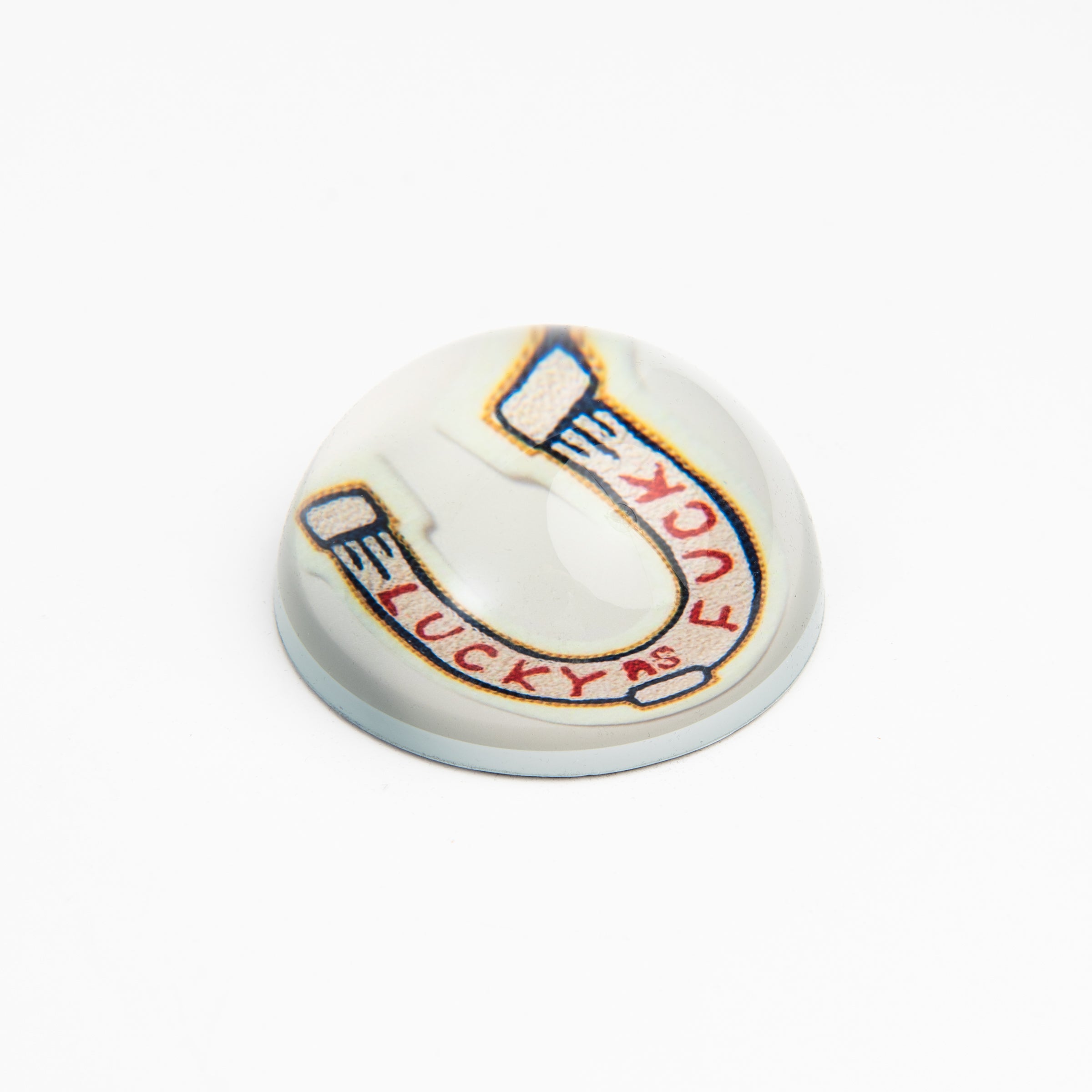 Lucky As F**K Paperweight on a white background at Addison West