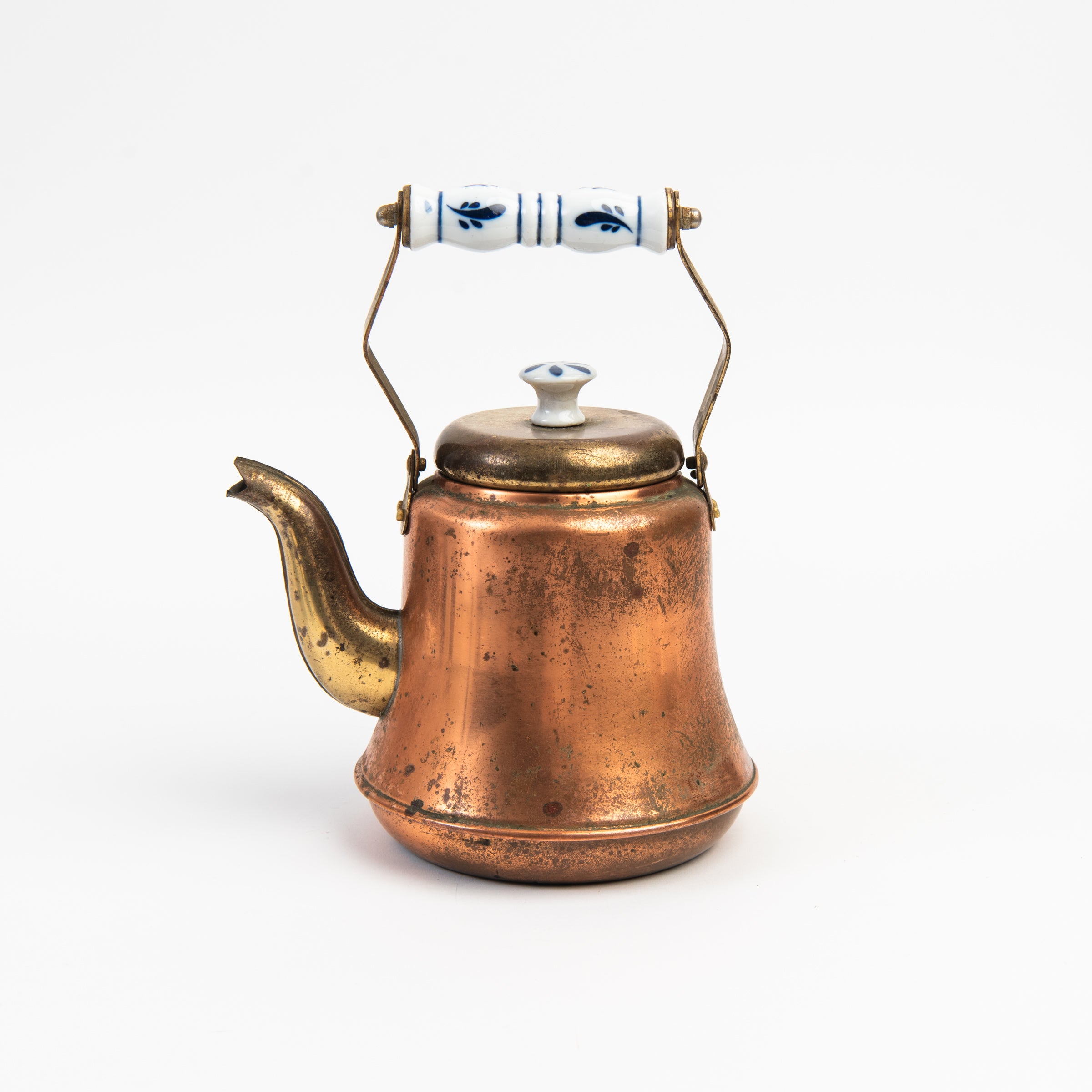 Vintage Copper Tea Pot with Delftware on a white background at Addison West