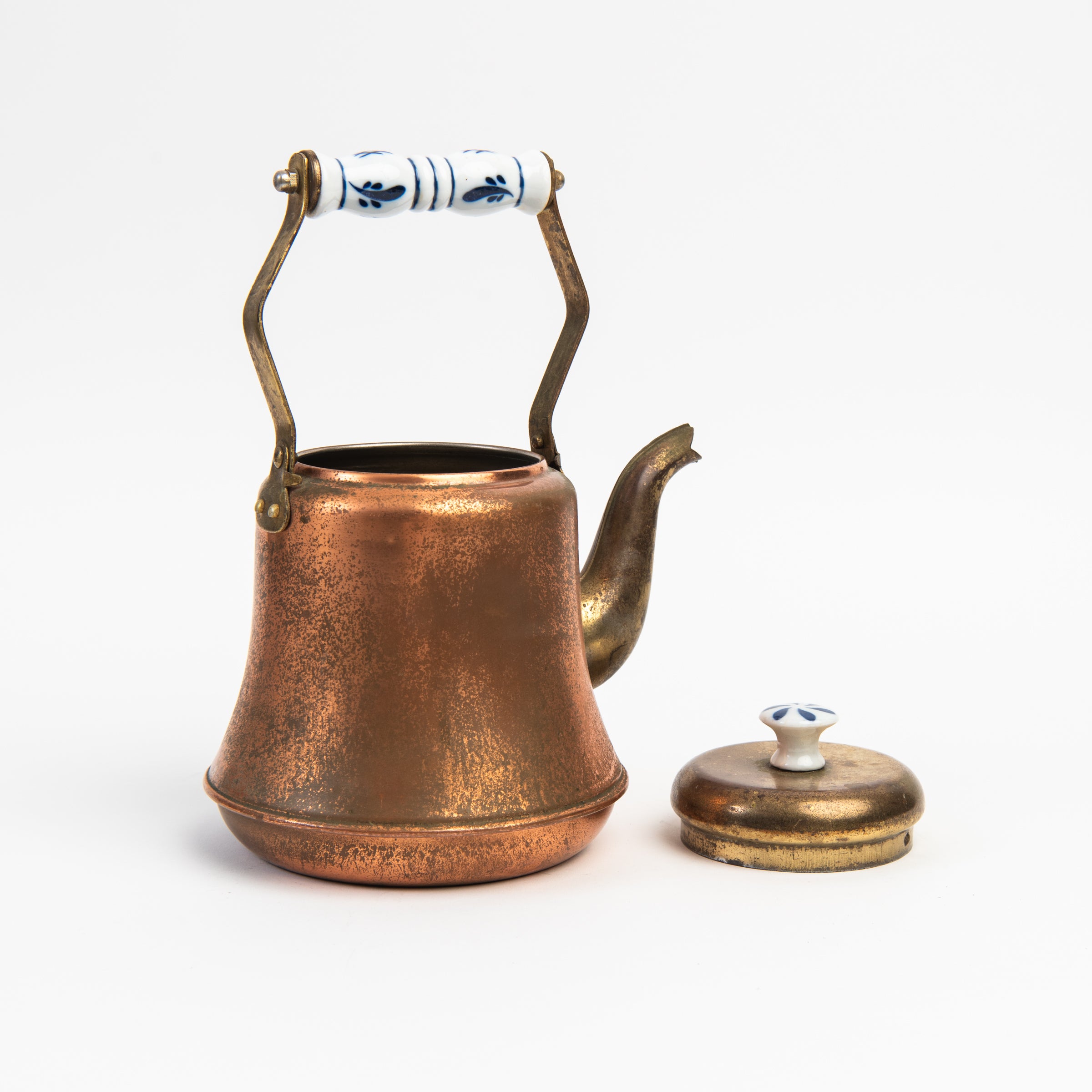 Vintage Copper Tea Pot with Delftware on a white background at Addison West