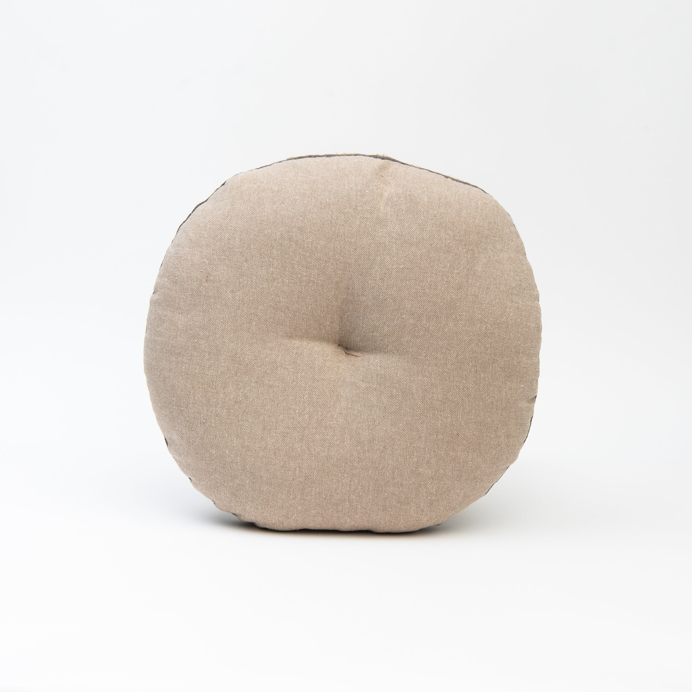 Back of Wildflower Round Pillow in Charcoal on a white background at Addison West 