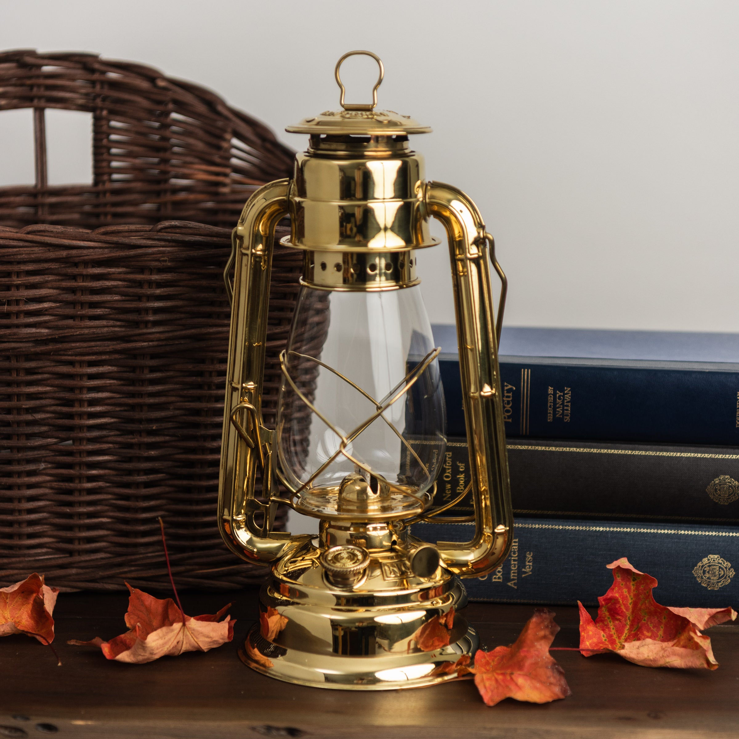 Vermont Lantern in Brass on a wood table at Addison West