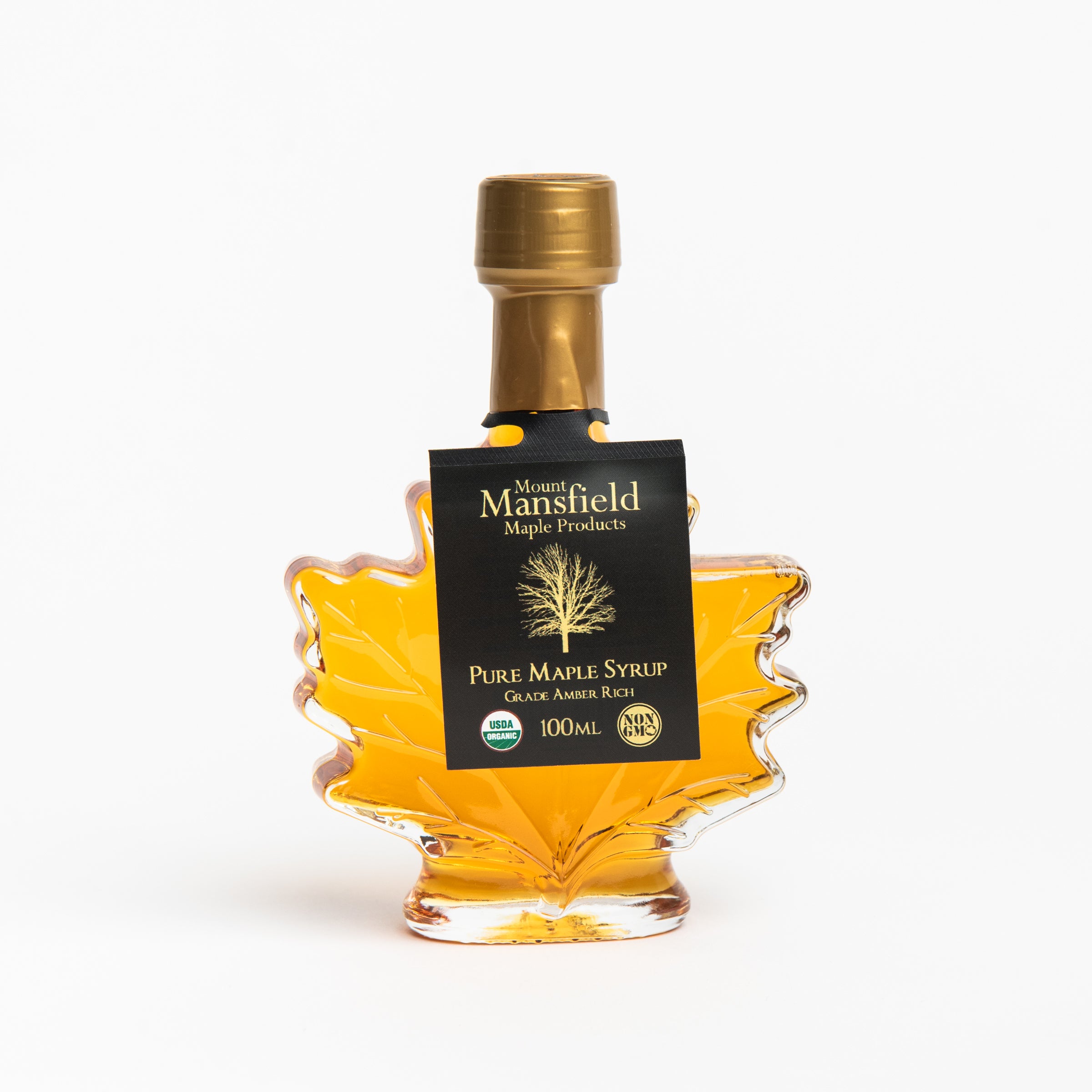 Mount Mansfield Maple Leaf Bottle Maple Syrup on a white background at Addison West