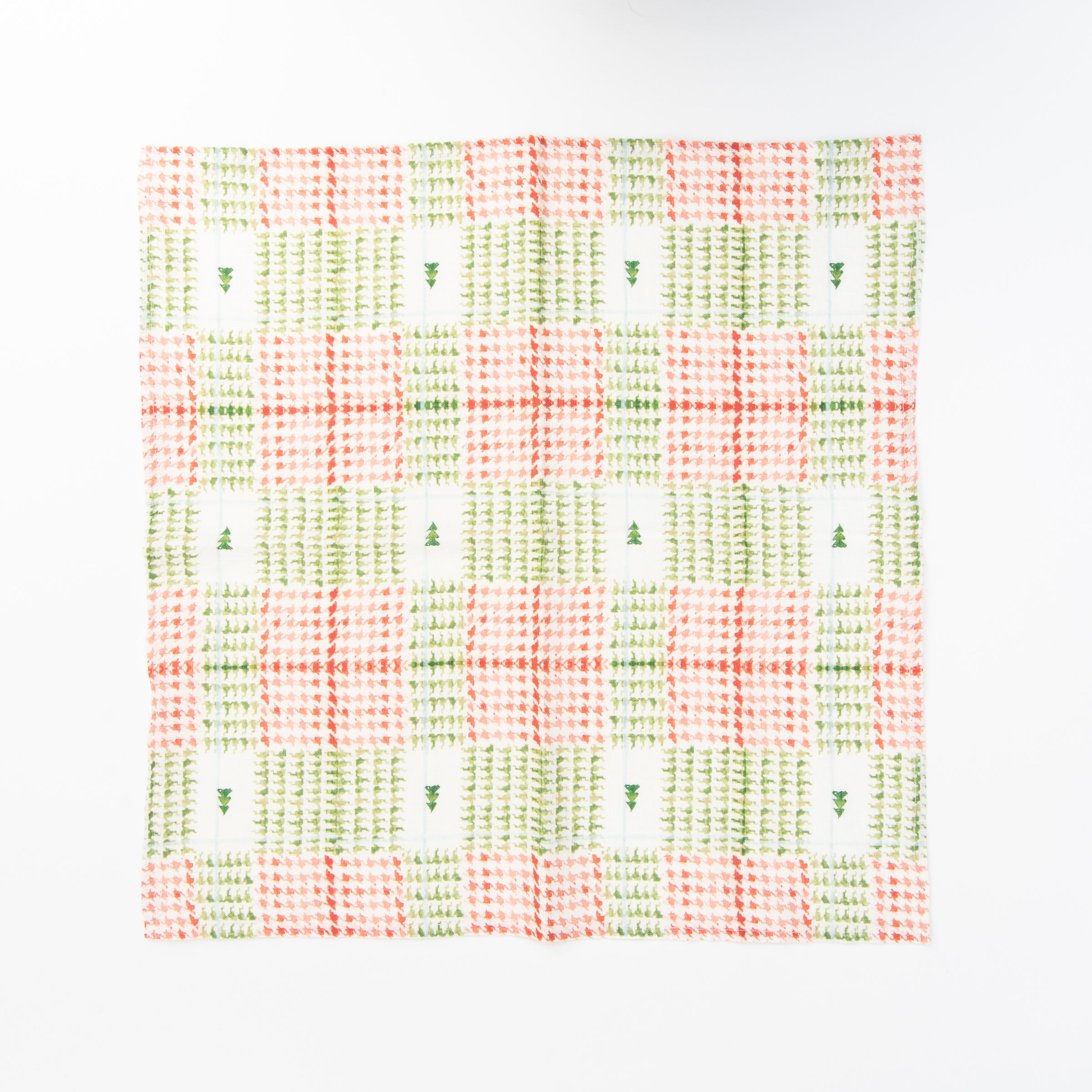 Linen Dinner Napkins in Xmas Plaid on a white table at Addison West