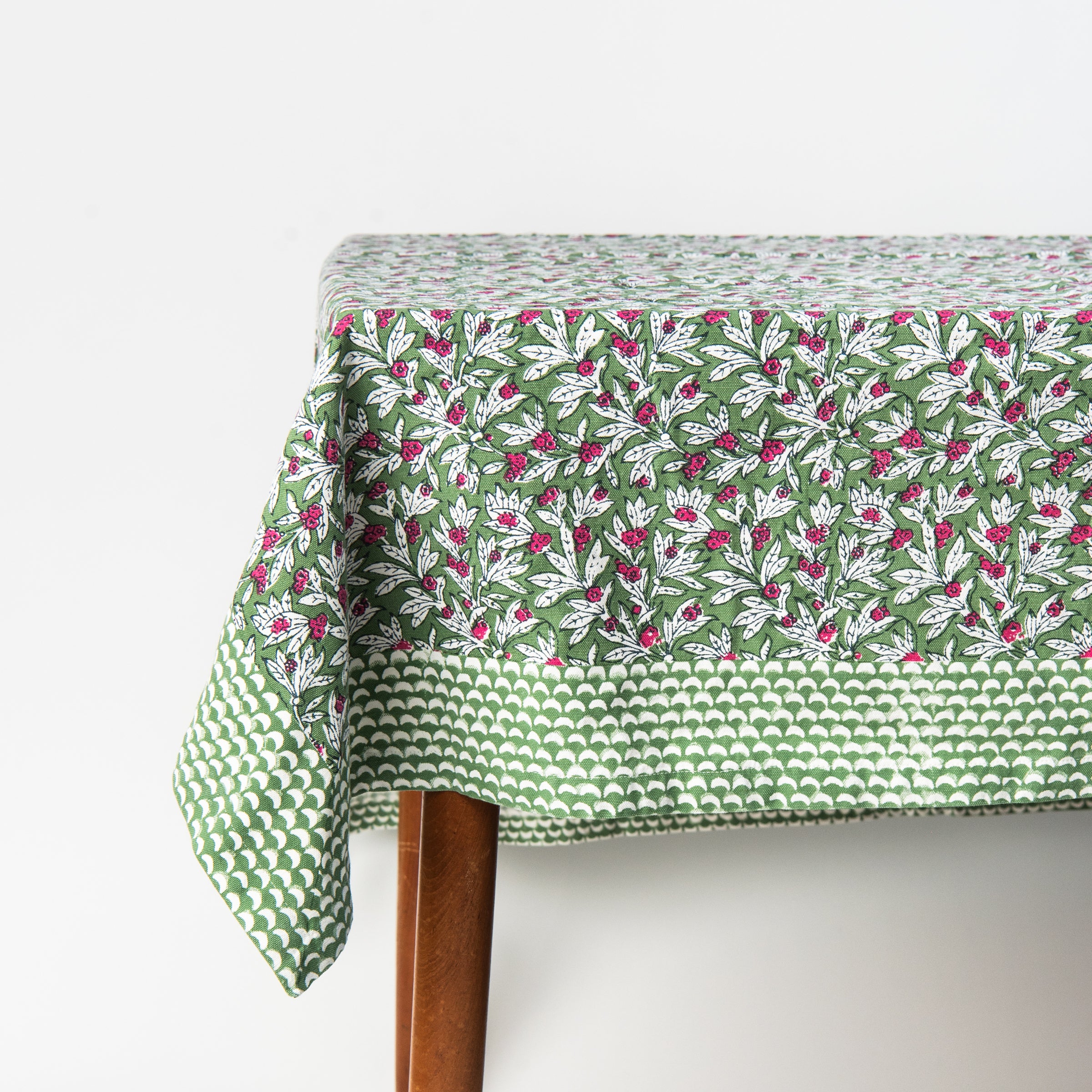Block Print Tablecloth in Wakame Green on a white background at Addison West