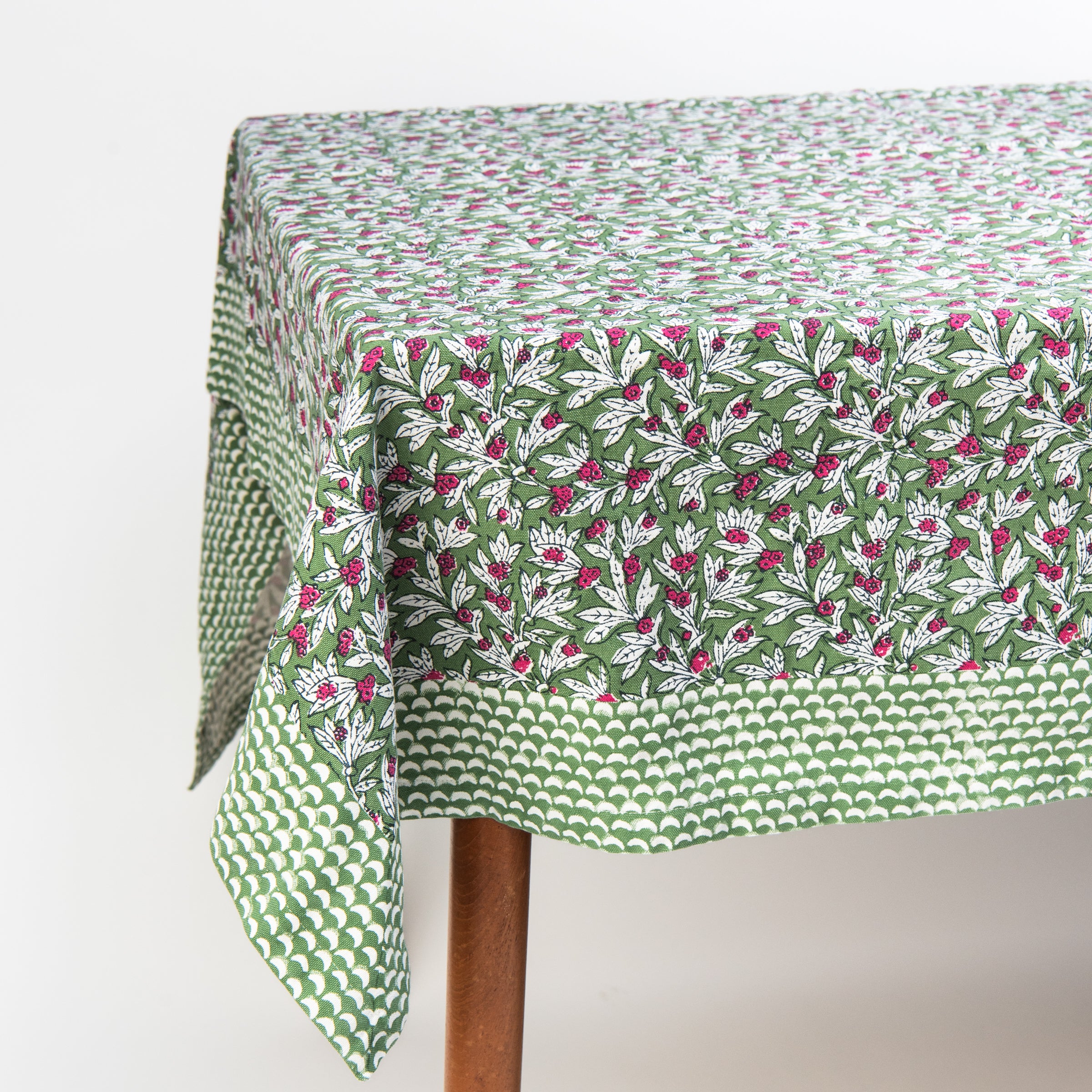 Block Print Tablecloth in Wakame Green on a white background at Addison West