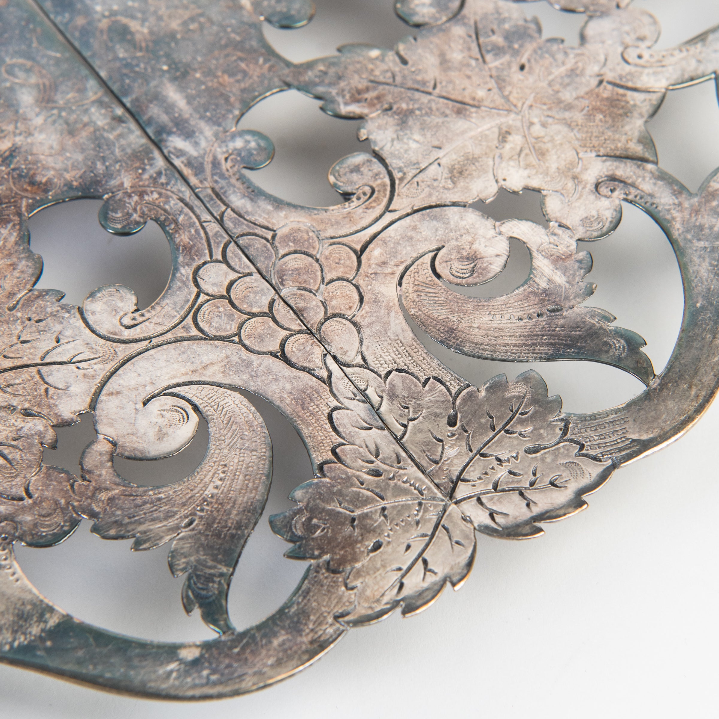 Close up of Vintage Silver Trivet on a white background at Addison West