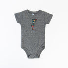 Vermont Baby Bodysuit - Wildflower on a white background at Addison West