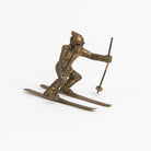 Vintage Brass Skier on a white background at Addison West