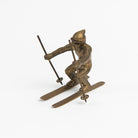 Vintage Brass Skier on a white background at Addison West