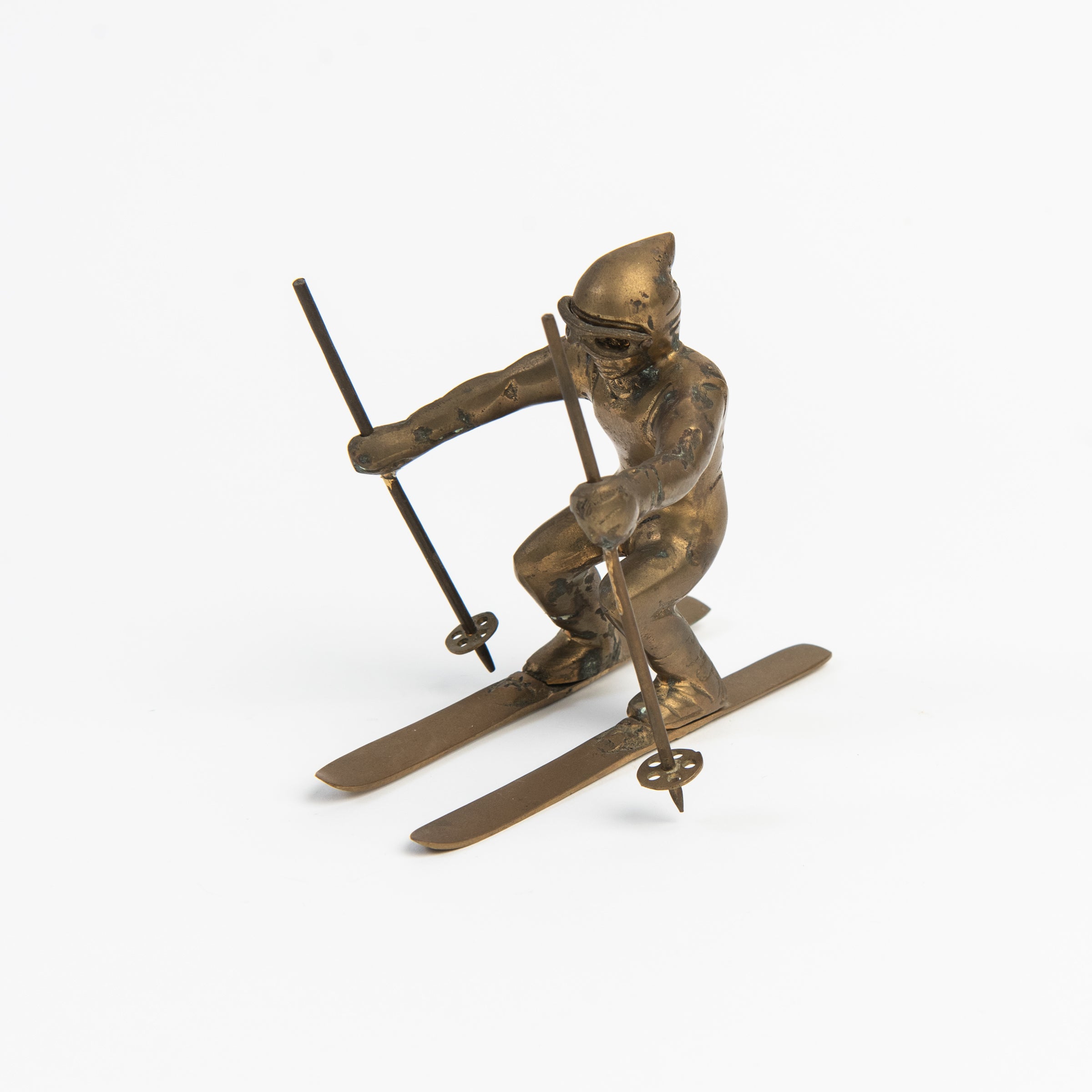 Vintage Brass Skier on a white background at Addison West