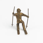 Vintage Brass Skier on a white background at Addison West