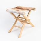 Teakwood and Goat Fur Folding Stool on a white background at Addison West