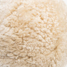 Close up of Sheepskin Ball Throw Pillow at Addison West