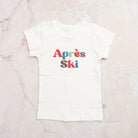 Kid Toddler Graphic Tee in Apres Ski on a marble table at Addison West
