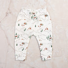 Into The Woods Organic Lounge Pants on a marble table at Addison West