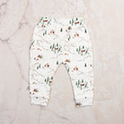 Into The Woods Organic Lounge Pants on a marble table at Addison West