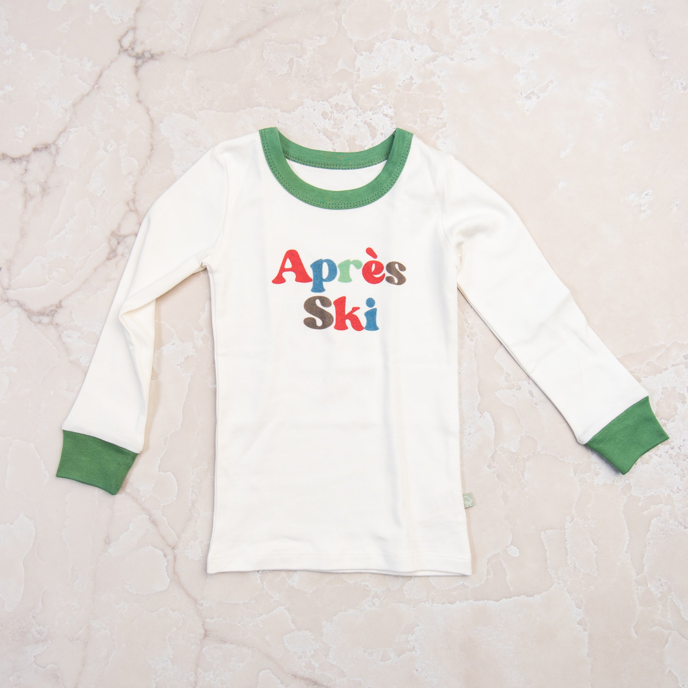 Apres Ski Organic Cotton Toddler PJs on a marble table at Addison West