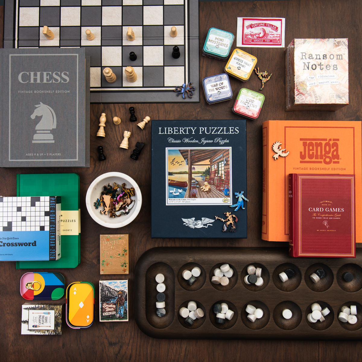 Collection of games and handmade wood puzzles on a wood table at Addison West