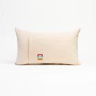Back of Red Crossed Ski Lumbar Pillow on a white background at Addison West
