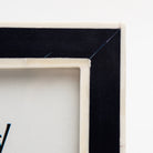 Close up of Classic Navy Frame on a white background at Addison West