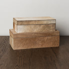 Medium and small Harrington Hide Box on a wood table at Addison West