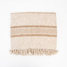 Tulum Striped Throw in Clay on a white background at Addison West
