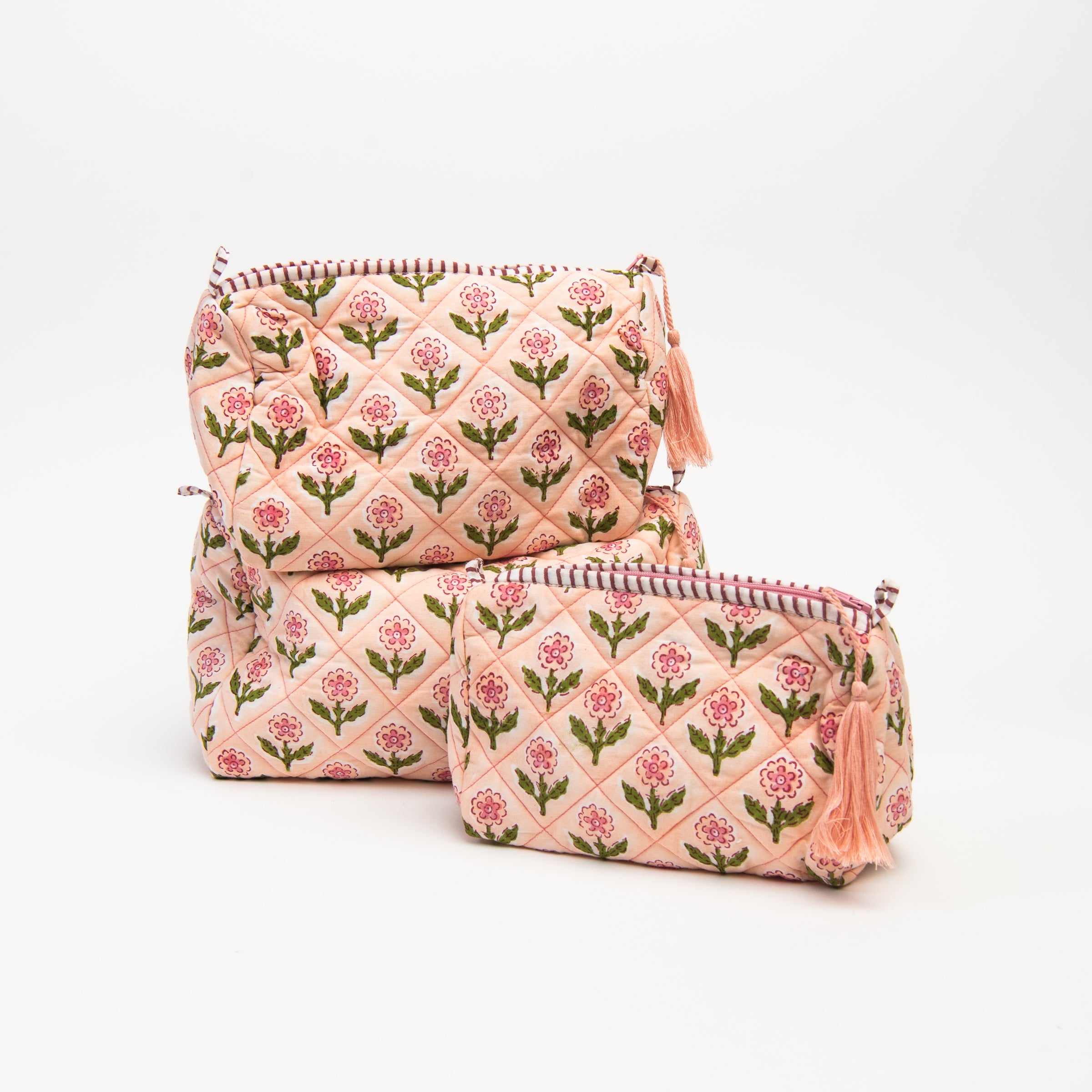 Mona Print Toiletry Bag in Pink on a white background at Addison West