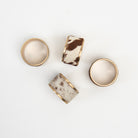 Cow Hide Napkin Rings, Set of 4 on a white background at Addison West