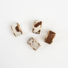 Cow Hide Napkin Rings, Set of 4 on a white background at Addison West