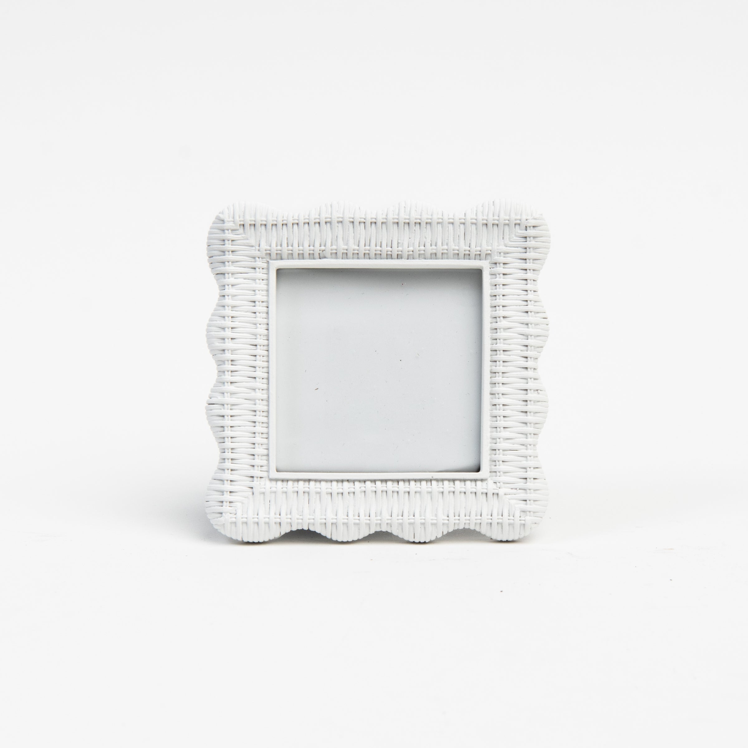 Scalloped Rattan Weave Picture Frame on a white background at Addison West