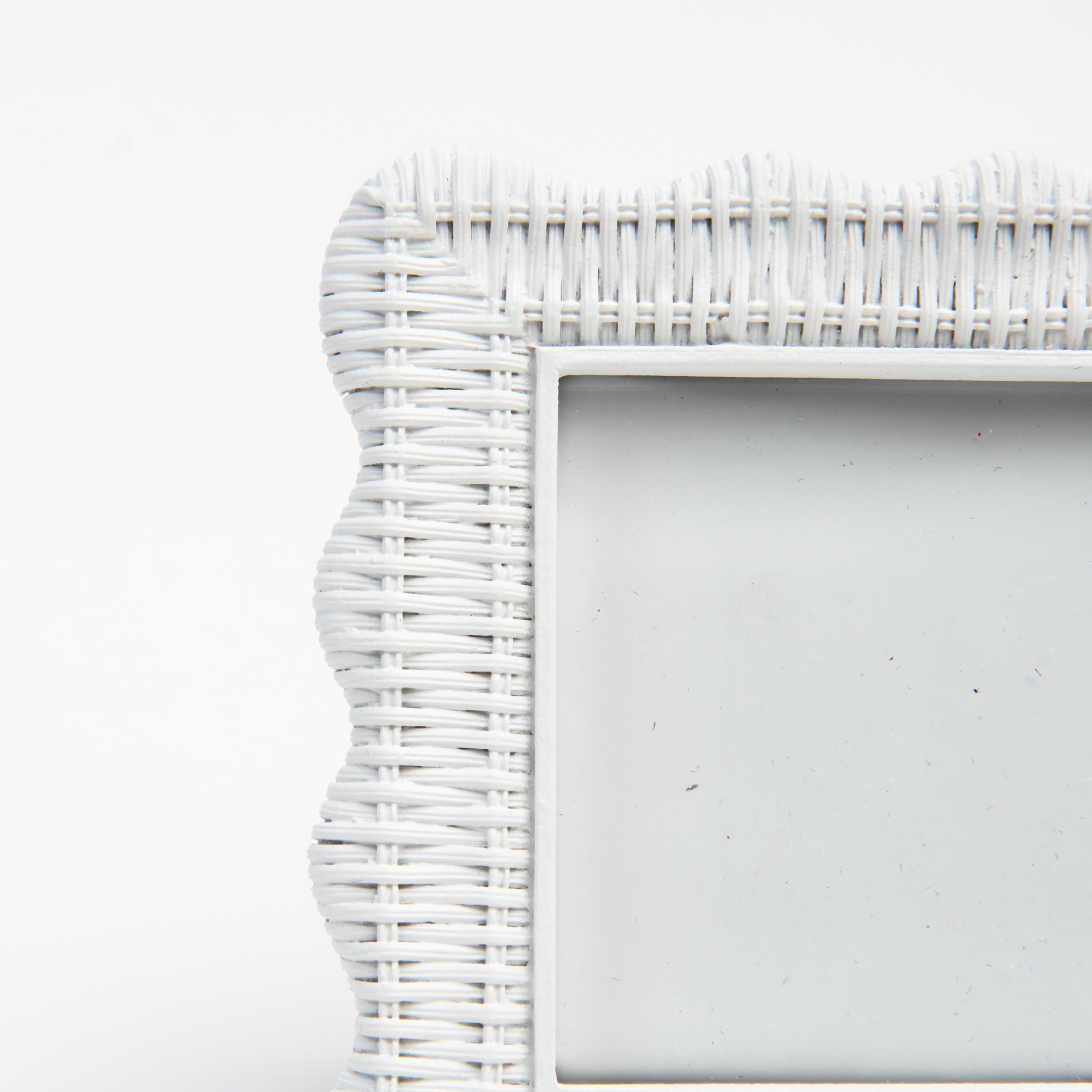 Scalloped Rattan Weave Picture Frame on a white background at Addison West