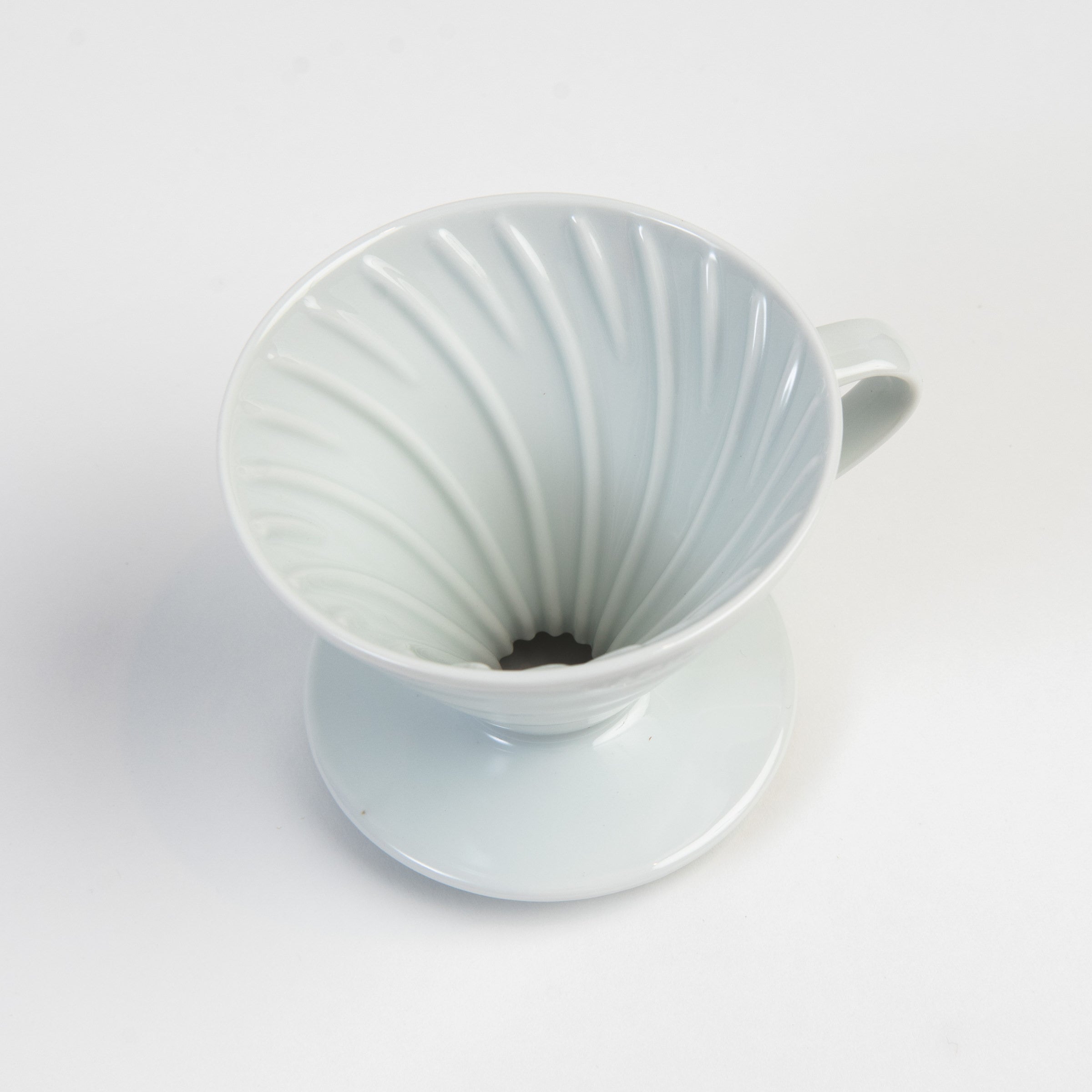 Hario V60 Ceramic Coffee Dripper 02 White on a white background at Addison West