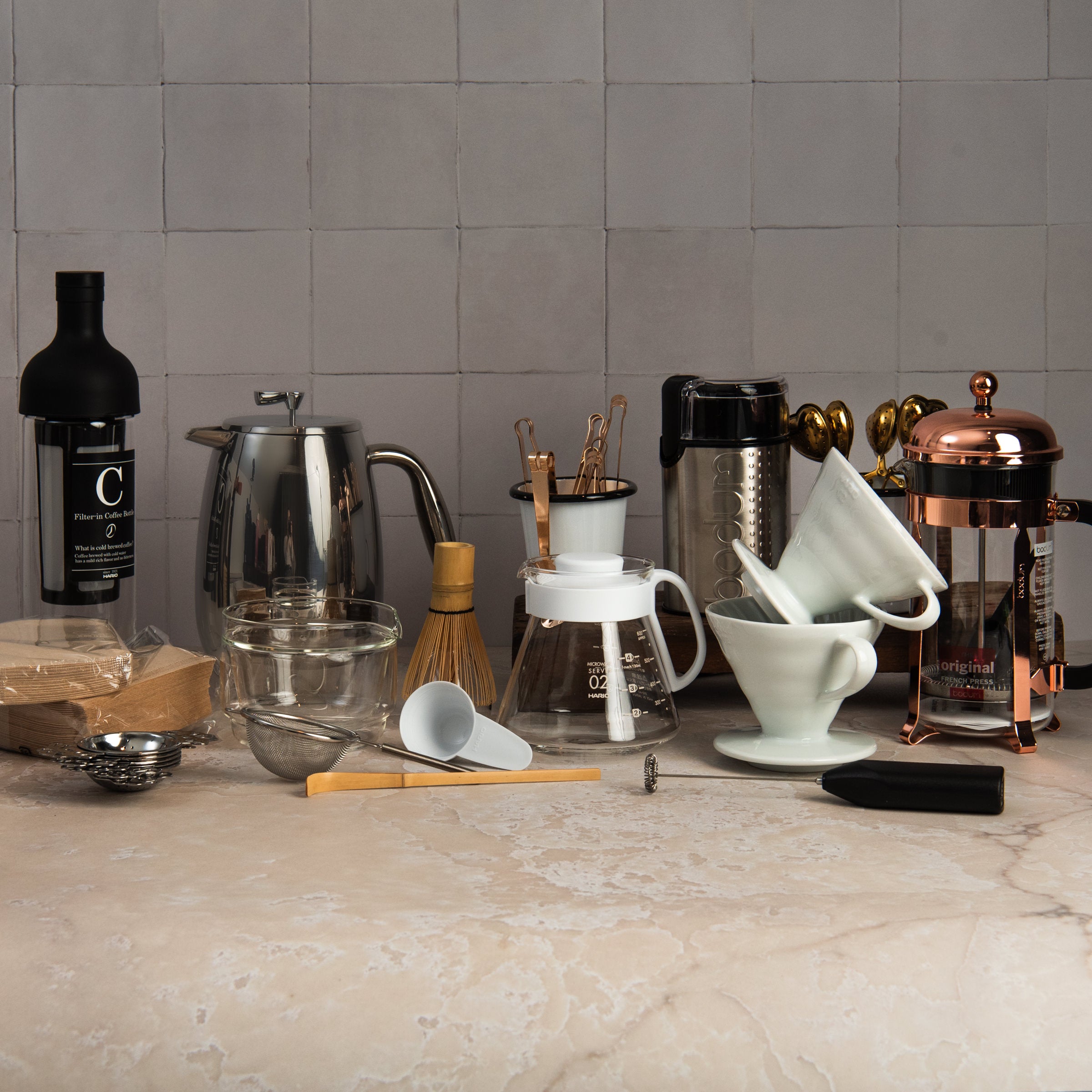 Coffee and tea tools collection on a kitchen table at Addison West