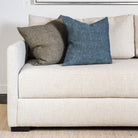 20" Linen Chambray Pillow in Denim and green on a sofa at Addison West