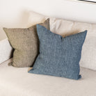 20" Linen Chambray Pillow in Denim and green on a sofa at Addison West