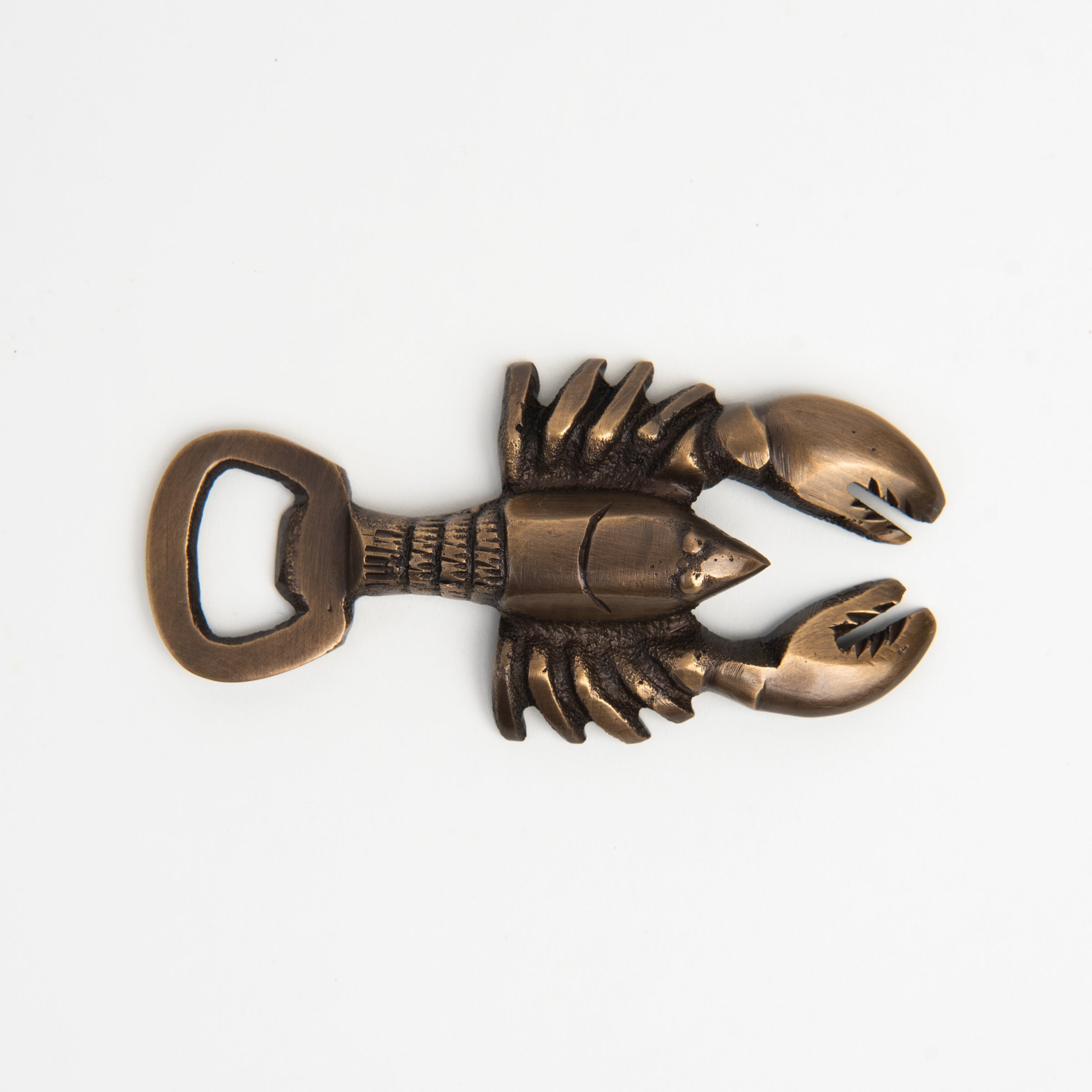 Antiqued Brass Lobster Bottle Opener on a white background at Addison West