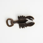 Antiqued Brass Lobster Bottle Opener on a white background at Addison West