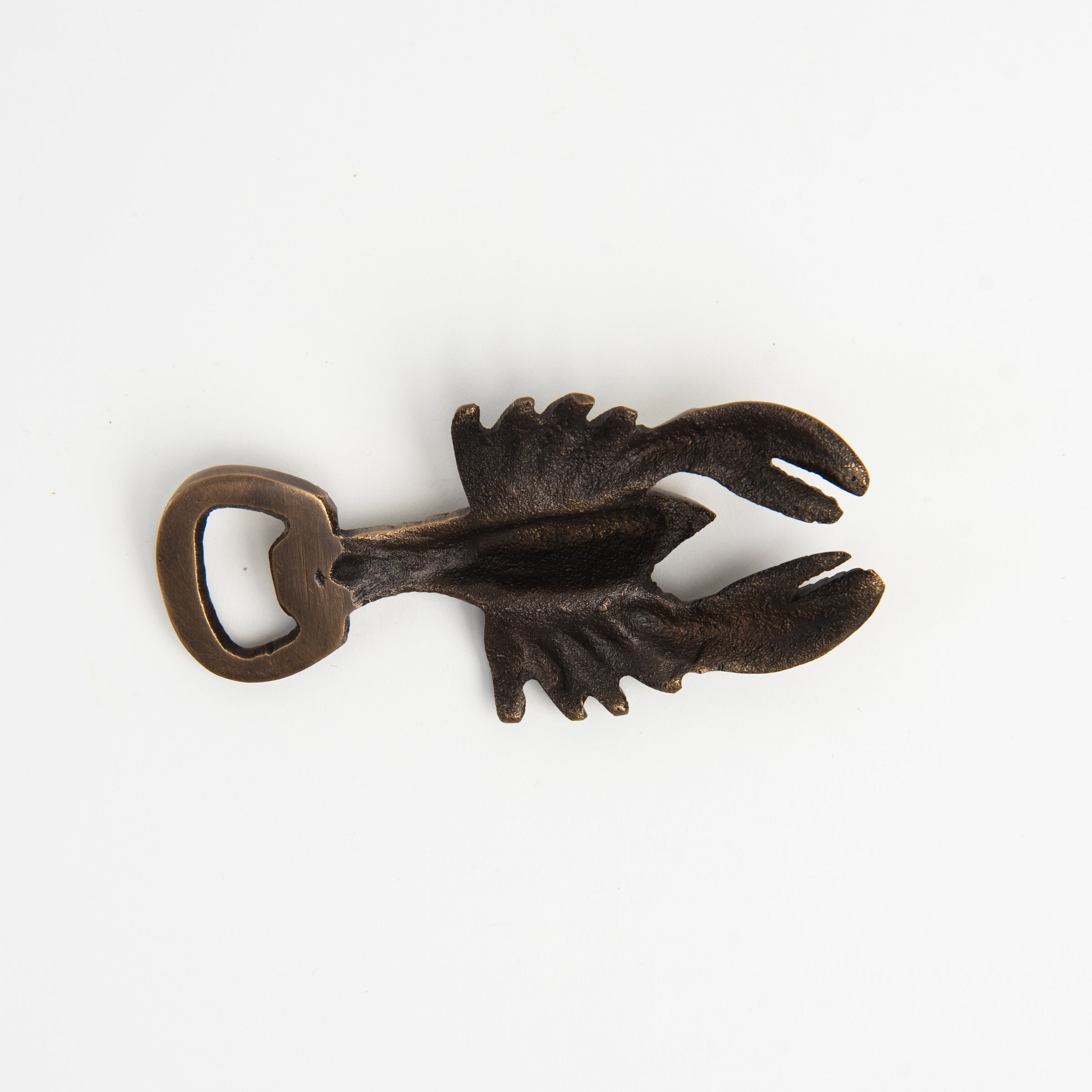 Antiqued Brass Lobster Bottle Opener on a white background at Addison West