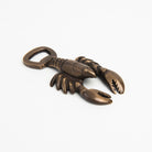 Antiqued Brass Lobster Bottle Opener on a white background at Addison West