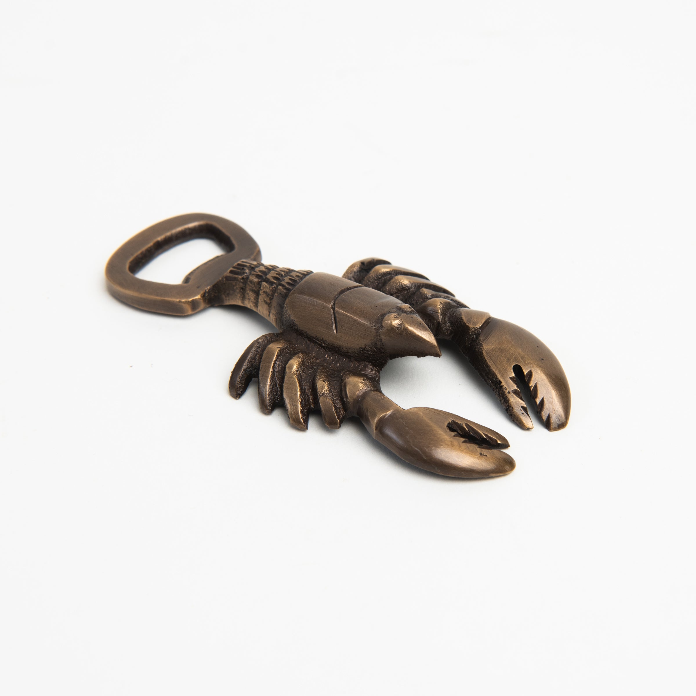 Antiqued Brass Lobster Bottle Opener on a white background at Addison West